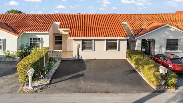4609 SW 143rd Pl, Miami, FL 33175 - view of front of home featuring a tile roof and stucco siding
