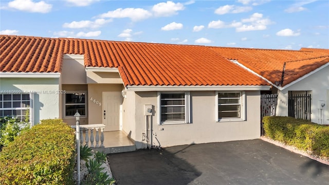 4609 SW 143rd Pl, Miami, FL 33175 - view of front facade with a tiled roof and stucco siding