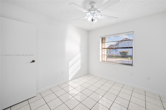 4609 SW 143rd Pl, Miami, FL 33175 - empty room with a textured ceiling, ceiling fan, baseboards, and light tile patterned floors