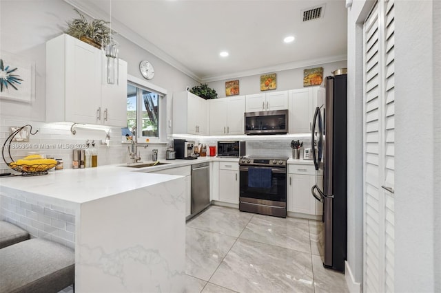 22607 SW 89th Pl, Cutler Bay, FL 33190 - kitchen featuring appliances with stainless steel finishes, backsplash, light stone counters, crown molding, and a sink