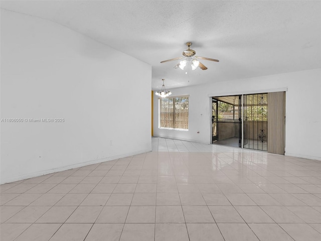 3034 NW 204th Ter, Miami Gardens, FL 33056 - spare room with ceiling fan, light tile patterned floors, a chandelier, baseboards, and a textured ceiling