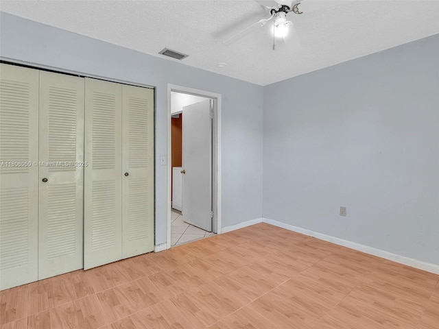 3034 NW 204th Ter, Miami Gardens, FL 33056 - unfurnished bedroom with a closet, baseboards, ceiling fan, and a textured ceiling