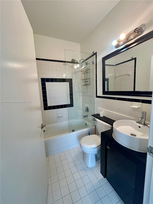 1244 Pennsylvania Ave Unit 305, Miami Beach, FL 33139 - bathroom featuring tile patterned flooring, tile walls,  shower combination, toilet, and vanity