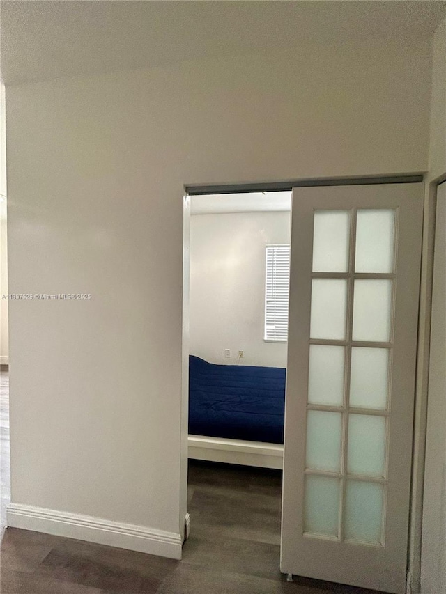 1244 Pennsylvania Ave Unit 305, Miami Beach, FL 33139 - unfurnished bedroom with baseboards and wood finished floors