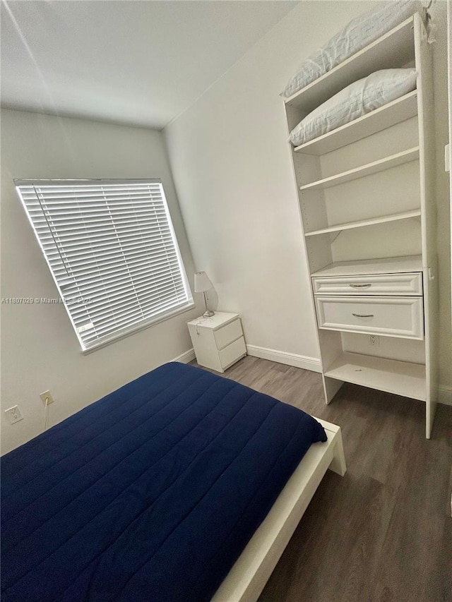 1244 Pennsylvania Ave Unit 305, Miami Beach, FL 33139 - bedroom featuring dark wood finished floors and baseboards