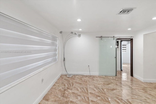 7601 Simms St, Hollywood, FL 33024 - unfurnished room featuring recessed lighting, baseboards, marble finish flooring, and a barn door