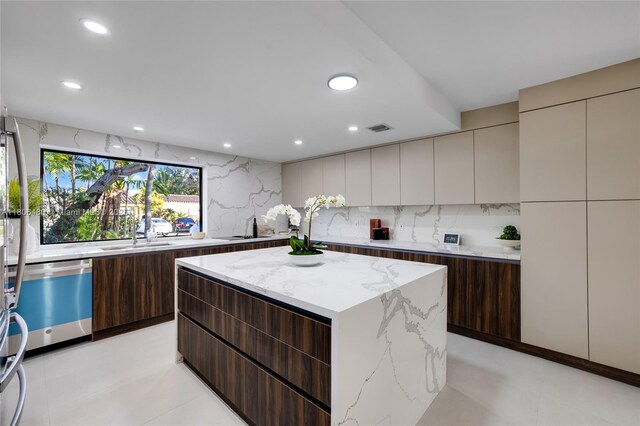 210 NE 107th St, Miami Shores, FL 33161 - kitchen featuring modern cabinets, dishwashing machine, a center island, and recessed lighting