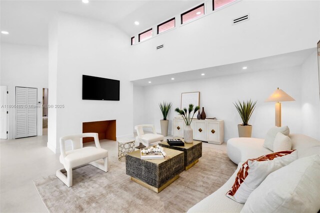 210 NE 107th St, Miami Shores, FL 33161 - living area with high vaulted ceiling, recessed lighting, and concrete floors