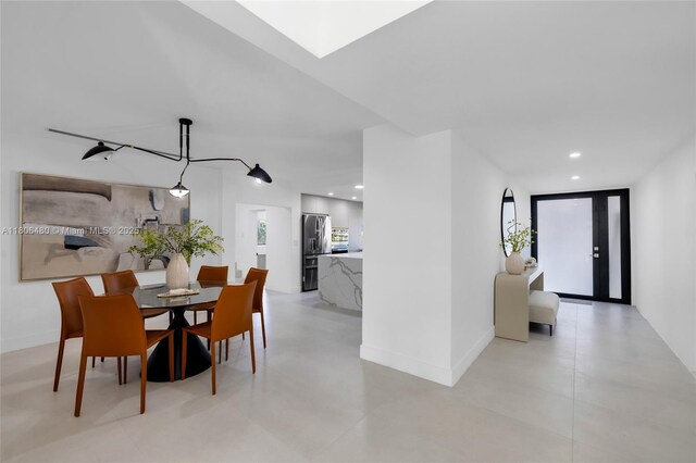 210 NE 107th St, Miami Shores, FL 33161 - dining space featuring baseboards and recessed lighting