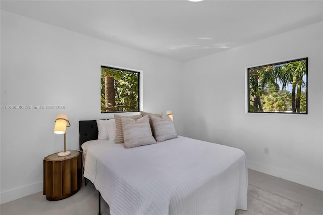 210 NE 107th St, Miami Shores, FL 33161 - bedroom featuring baseboards