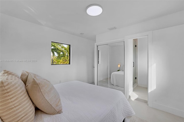 210 NE 107th St, Miami Shores, FL 33161 - bedroom with a closet and baseboards