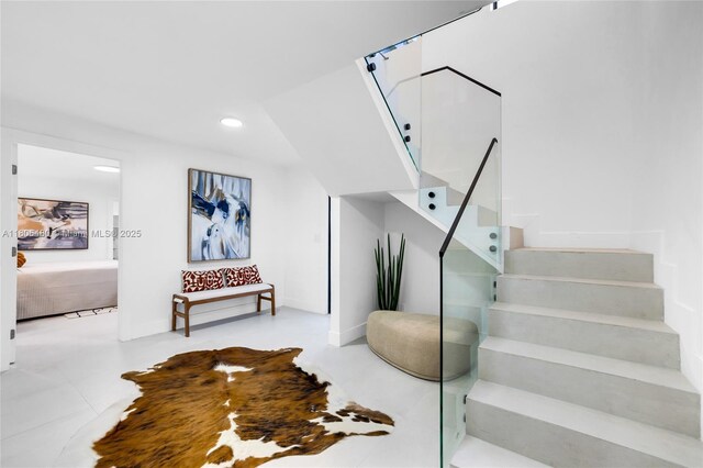 210 NE 107th St, Miami Shores, FL 33161 - stairway with recessed lighting and baseboards