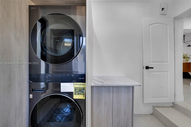 210 NE 107th St, Miami Shores, FL 33161 - washroom featuring stacked washer / dryer