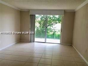 9320 Fontainebleau Blvd Unit 215, Miami, FL 33172 - unfurnished room featuring crown molding and baseboards