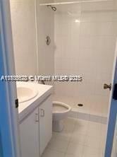 9320 Fontainebleau Blvd Unit 215, Miami, FL 33172 - full bath featuring tile patterned floors, toilet, a tile shower, and vanity