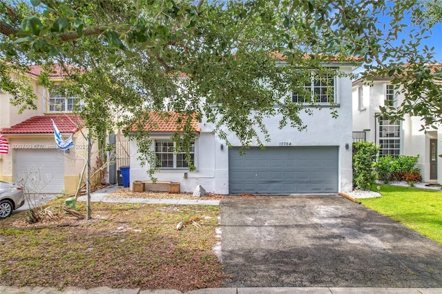 10764 Lenox Rd, Cooper City, FL 33026 - view of front of home featuring stucco siding, an attached garage, driveway, and a tiled roof