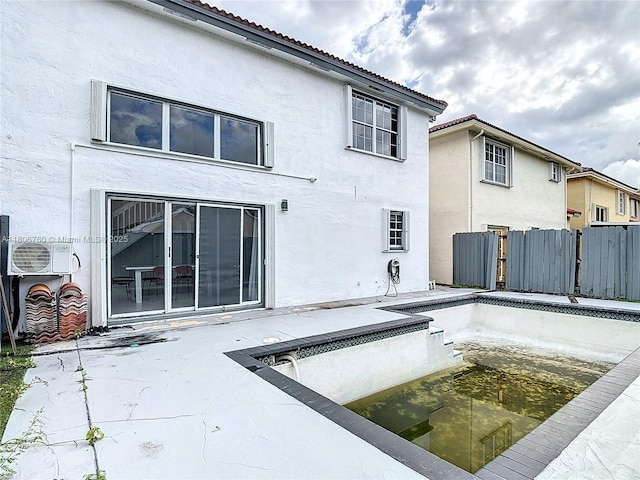 10764 Lenox Rd, Cooper City, FL 33026 - rear view of property with stucco siding, a cooling unit, an empty pool, a tile roof, and a patio area