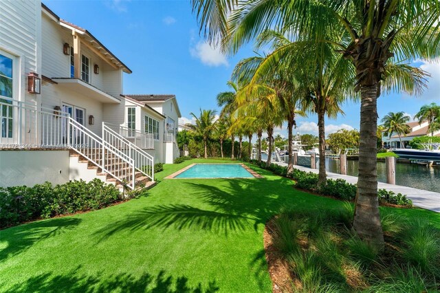 1051 San Pedro Ave, Coral Gables, FL 33156 - view of green lawn with a water view and stairway