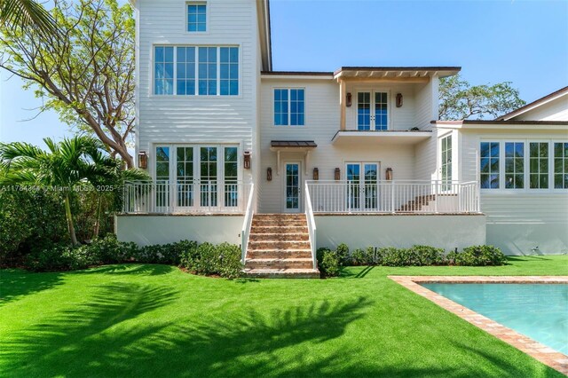 1051 San Pedro Ave, Coral Gables, FL 33156 - rear view of property featuring a yard