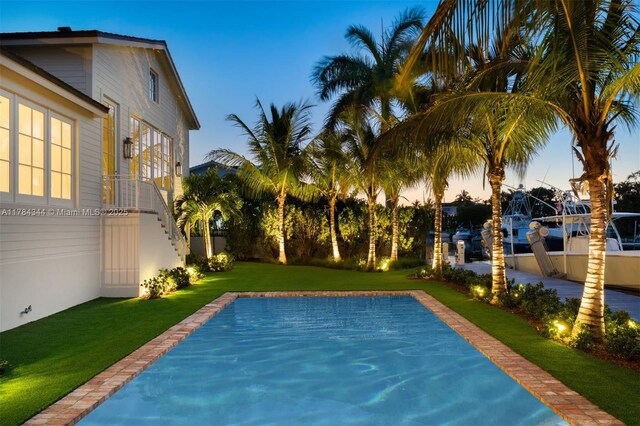 1051 San Pedro Ave, Coral Gables, FL 33156 - pool at dusk with a yard