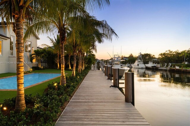 1051 San Pedro Ave, Coral Gables, FL 33156 - dock area featuring a water view and an outdoor pool