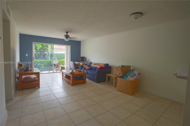 11201 SW 13th St Unit 101, Pembroke Pines, FL 33025 - living area with ceiling fan, a textured ceiling, and light tile patterned floors