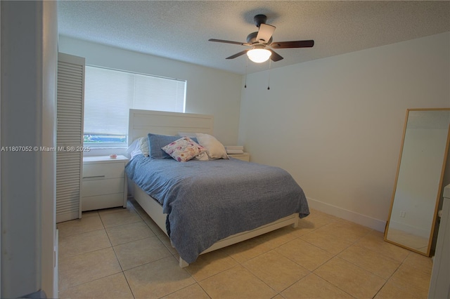 11201 SW 13th St Unit 101, Pembroke Pines, FL 33025 - bedroom featuring a textured ceiling, light tile patterned floors, and ceiling fan