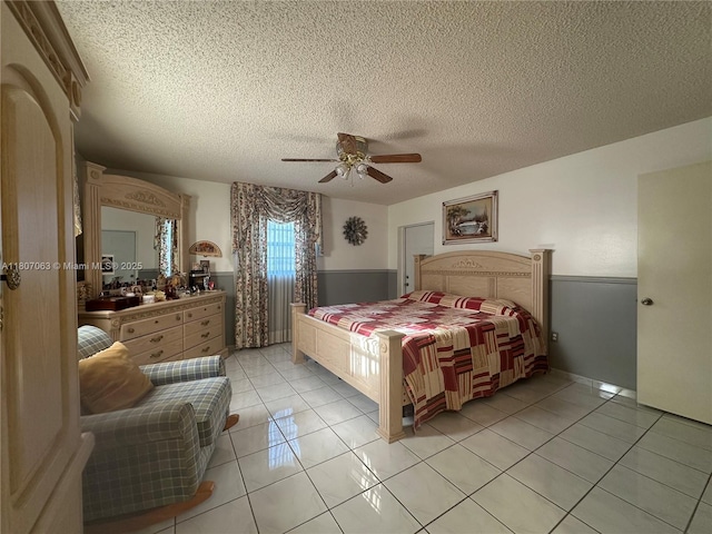 10075 NW 129th Ter, Hialeah Gardens, FL 33018 - bedroom featuring a textured ceiling, a ceiling fan, and light tile patterned floors