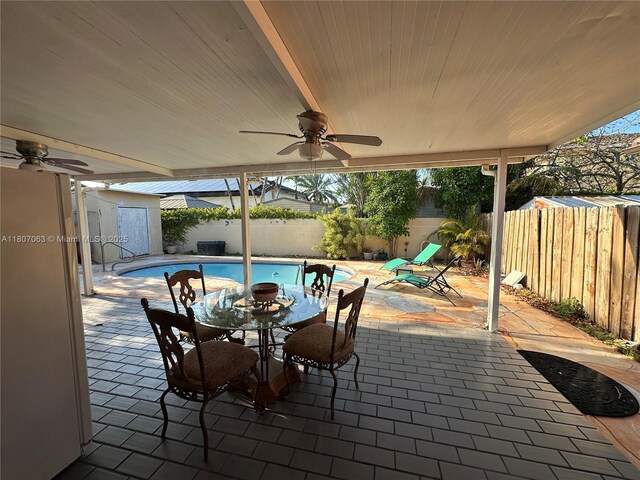 10075 NW 129th Ter, Hialeah Gardens, FL 33018 - fenced backyard featuring a ceiling fan and a patio