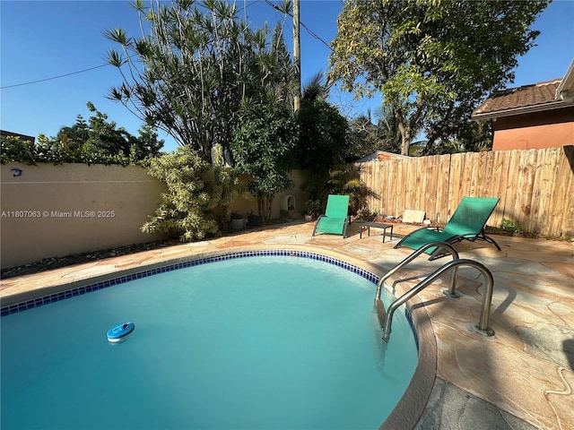 10075 NW 129th Ter, Hialeah Gardens, FL 33018 - view of pool featuring a fenced backyard and a patio area