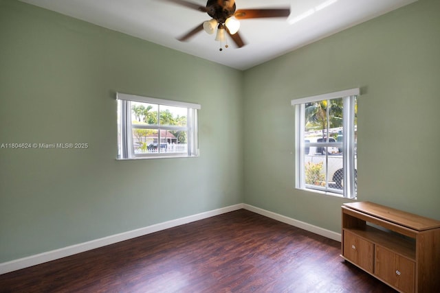 2757 NW 29th St, Miami, FL 33142 - empty room featuring a ceiling fan, dark wood-style floors, and baseboards