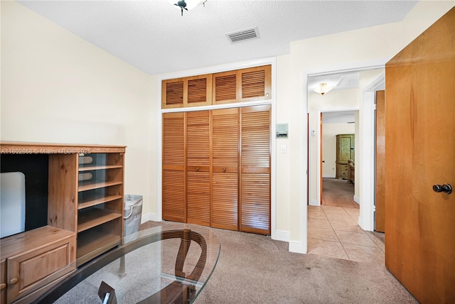 43 NW 109th Ct, Miami, FL 33172 - carpeted home office featuring tile patterned flooring, baseboards, and a textured ceiling