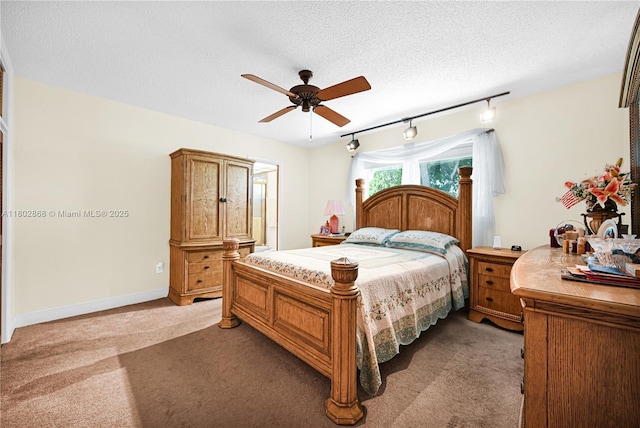 43 NW 109th Ct, Miami, FL 33172 - bedroom with light colored carpet, a textured ceiling, rail lighting, a ceiling fan, and baseboards