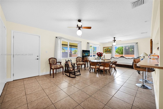 43 NW 109th Ct, Miami, FL 33172 - dining space with ceiling fan, light tile patterned floors, and a textured ceiling