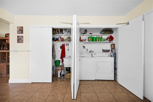 43 NW 109th Ct, Miami, FL 33172 - laundry room with washer and clothes dryer and light tile patterned flooring