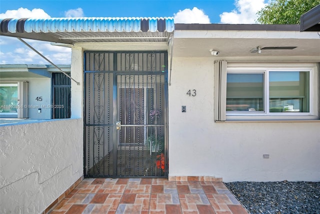 43 NW 109th Ct, Miami, FL 33172 - property entrance with stucco siding