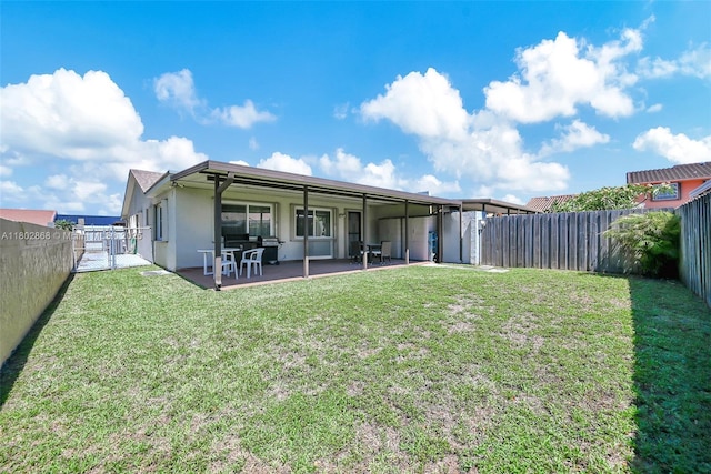 43 NW 109th Ct, Miami, FL 33172 - back of house featuring stucco siding, a patio area, and a gate