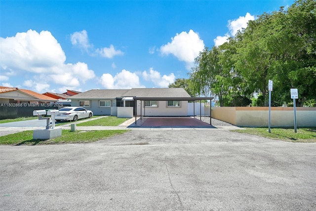 43 NW 109th Ct, Miami, FL 33172 - single story home with asphalt driveway and a carport