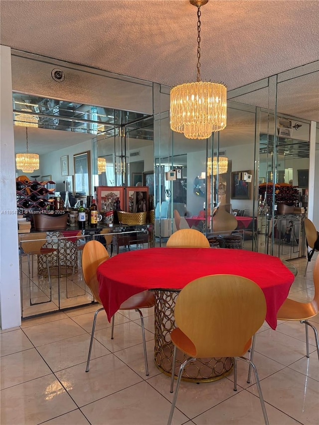 3850 Washington St Unit 1011, Hollywood, FL 33021 - tiled dining space featuring a chandelier and a textured ceiling