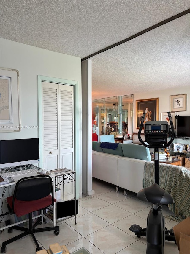3850 Washington St Unit 1011, Hollywood, FL 33021 - home office featuring a textured ceiling and light tile patterned flooring