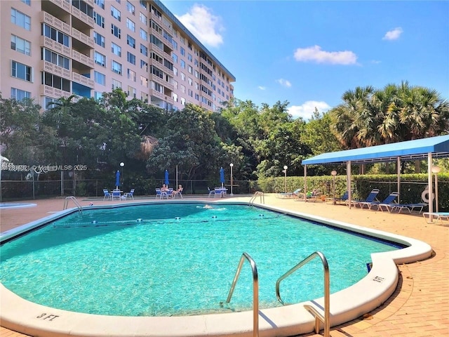 3850 Washington St Unit 1011, Hollywood, FL 33021 - community pool with a patio area