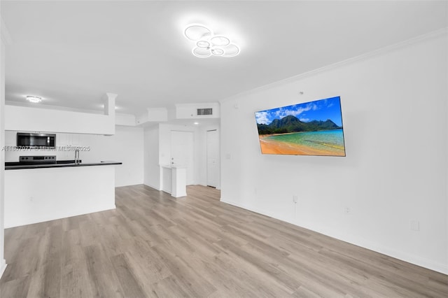 17150 N Bay Rd Unit 2814, Sunny Isles Beach, FL 33160 - unfurnished living room with wood finished floors and crown molding