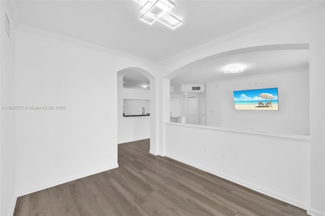 17150 N Bay Rd Unit 2814, Sunny Isles Beach, FL 33160 - spare room featuring arched walkways, crown molding, and wood finished floors