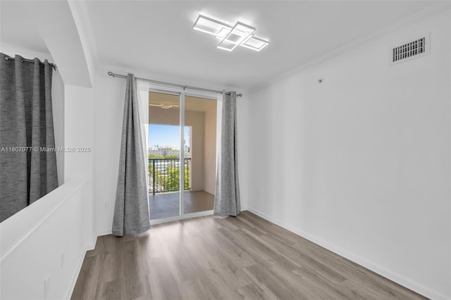 17150 N Bay Rd Unit 2814, Sunny Isles Beach, FL 33160 - empty room with wood finished floors and ornamental molding