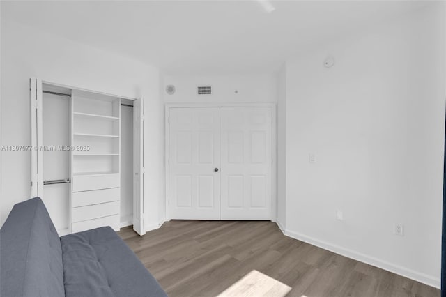 17150 N Bay Rd Unit 2814, Sunny Isles Beach, FL 33160 - unfurnished bedroom with wood finished floors