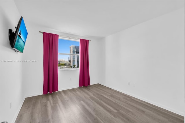 17150 N Bay Rd Unit 2814, Sunny Isles Beach, FL 33160 - empty room with wood finished floors and a view of city