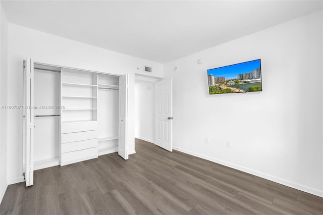 17150 N Bay Rd Unit 2814, Sunny Isles Beach, FL 33160 - unfurnished bedroom with dark wood finished floors and a closet