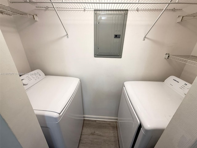 17150 N Bay Rd Unit 2814, Sunny Isles Beach, FL 33160 - washroom featuring electric panel, washer and dryer, and wood finished floors