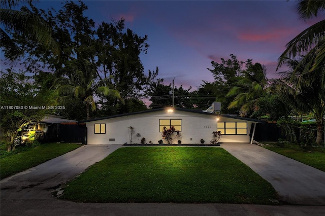 7531 Simms St, Hollywood, FL 33024 - view of front of property featuring concrete driveway, stucco siding, and central AC