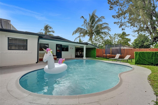 7531 Simms St, Hollywood, FL 33024 - view of pool featuring a trampoline and a patio